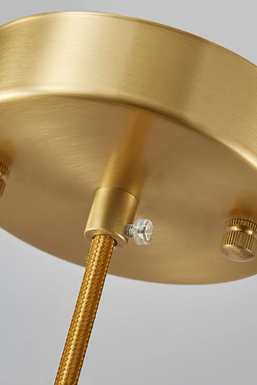 Close Up View of Brass Canopy and Suspension Cord