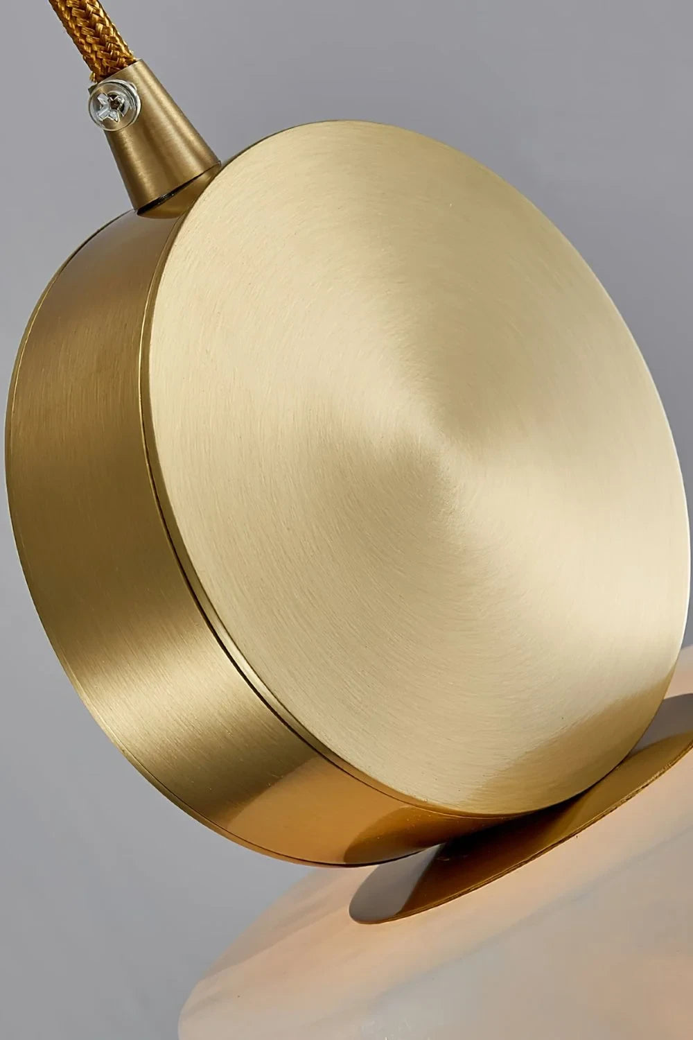 Close Up View of Brass Connector and Square Alabaster Shade
