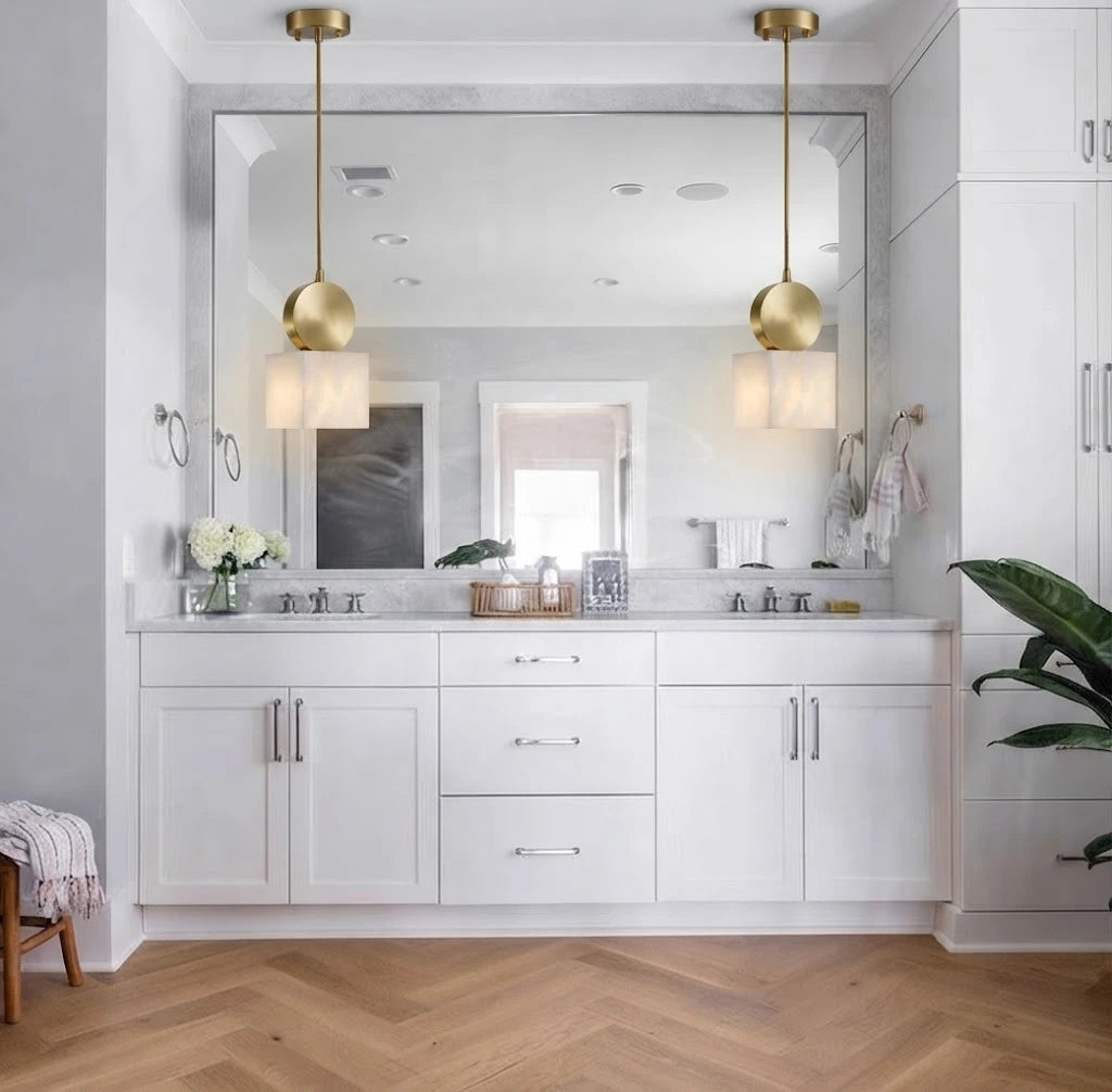 Modern Brass Alabaster Pendant Lights in Bathroom Vanity Setting