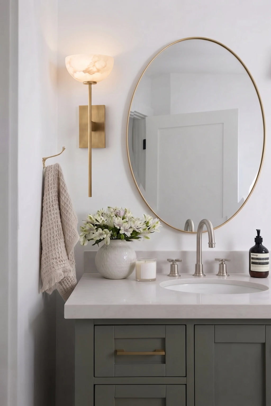 Modern Alabaster Wall Sconce Over Bathroom Vanity