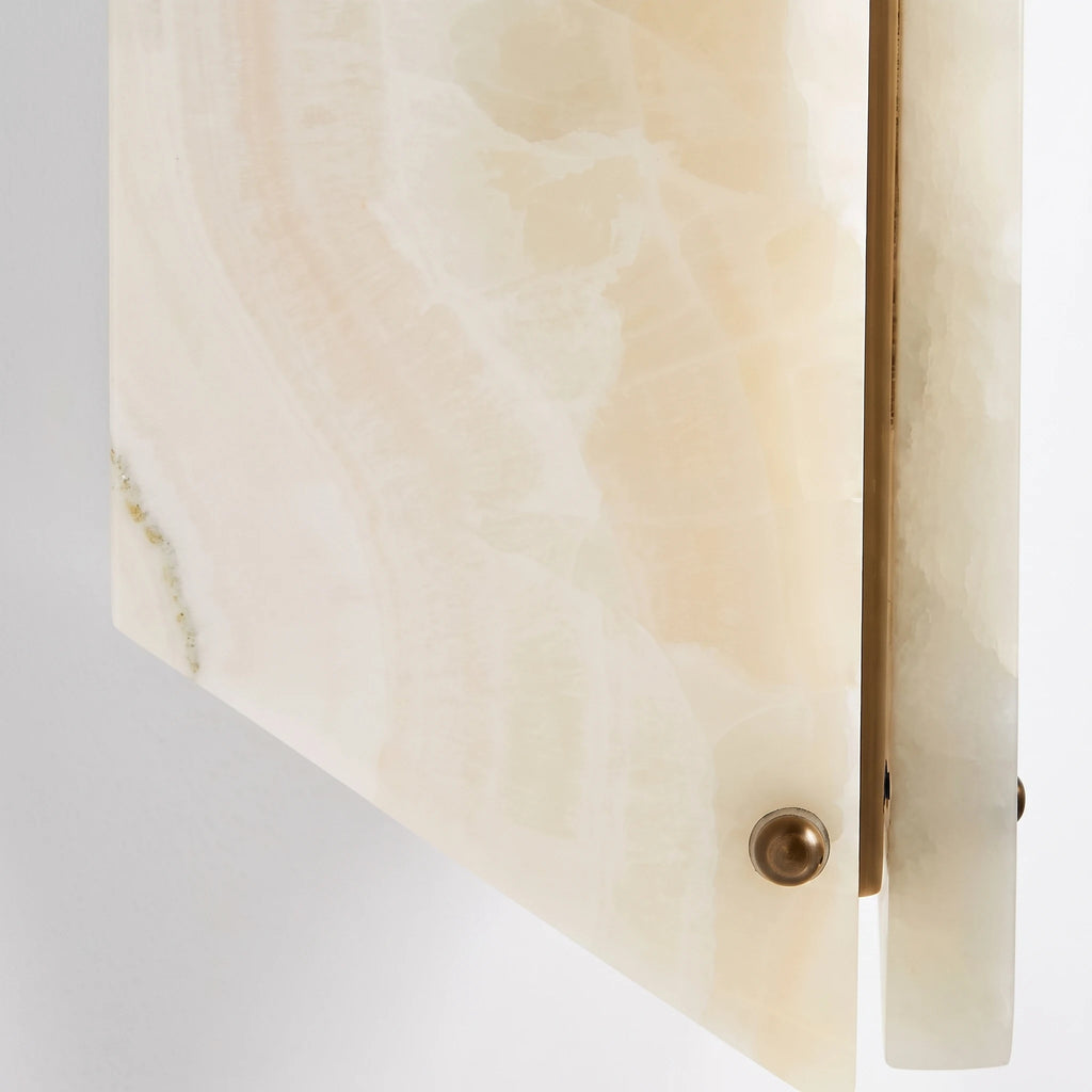 Close Up of Travertine Stone Plate with Brass Hardware Detail