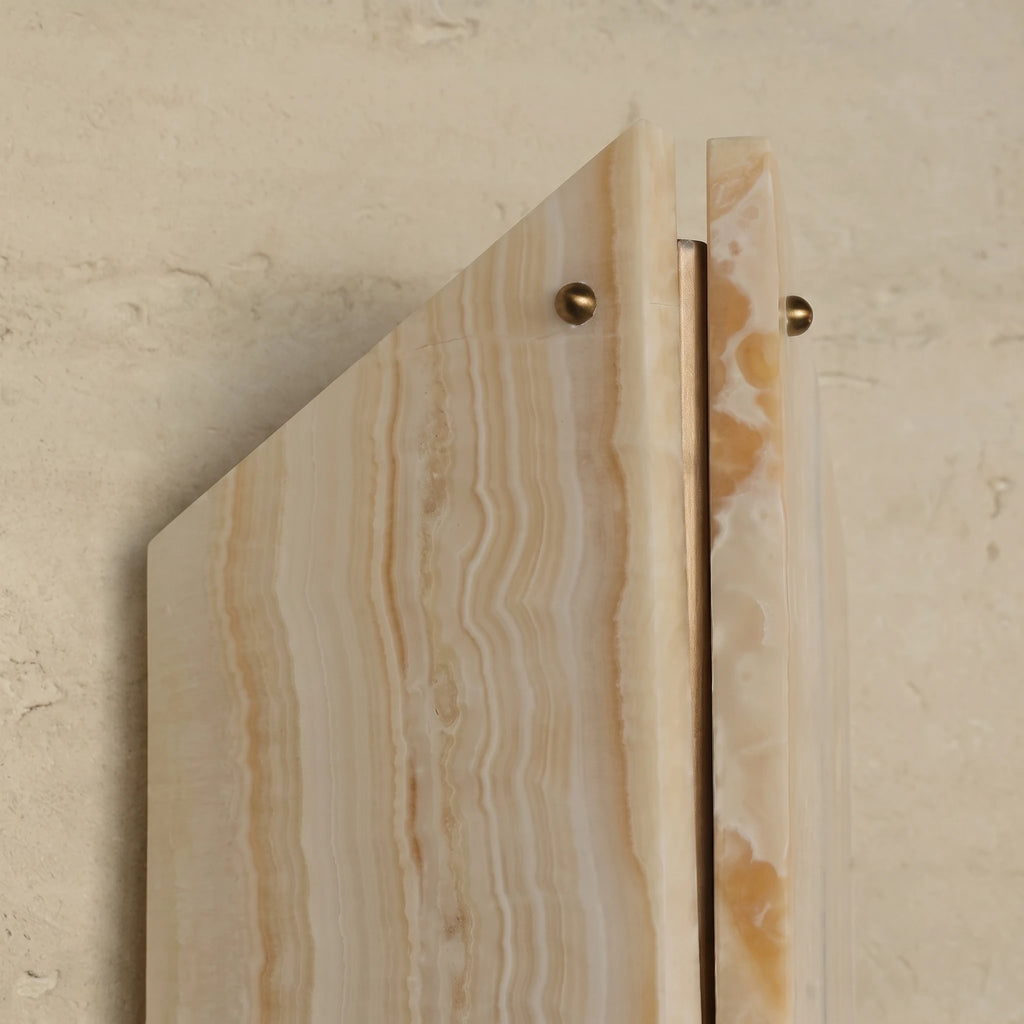 Detail of Geometric Cut Travertine Stone and Brass Screws