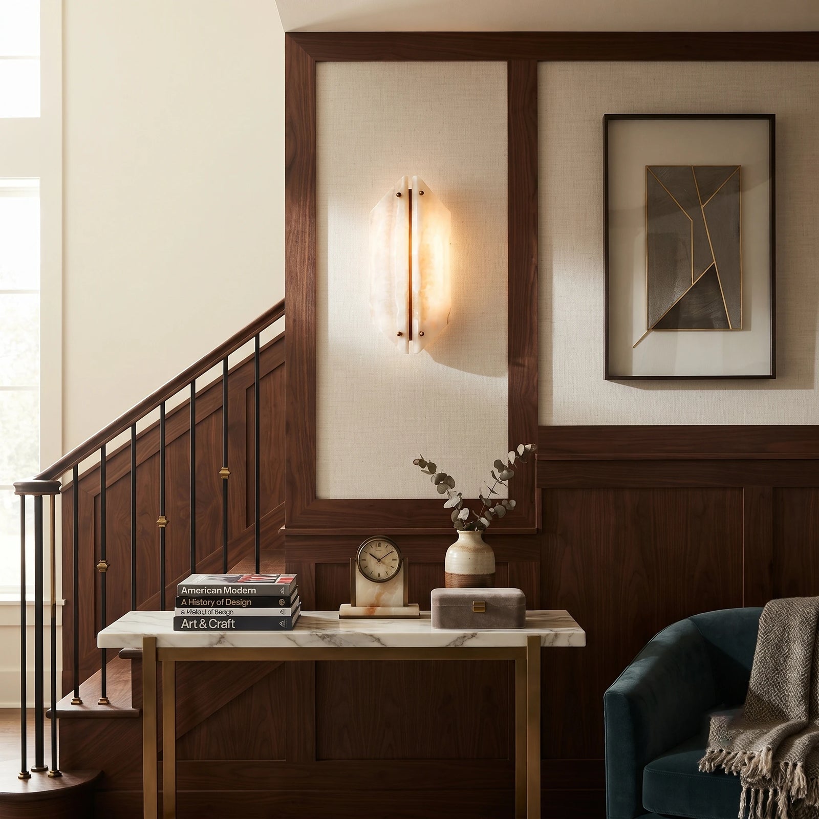 Travertine Wall Sconce above Console Table near Staircase