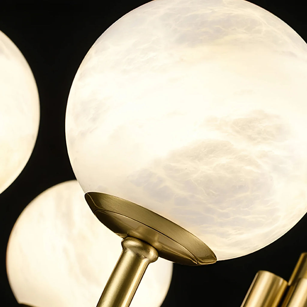 Close Up View of Glowing Alabaster Spheres and Brass Arms