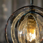 Close Up View of Illuminated Pumpkin Art Glass and Internal Warm Glow on Dark Background