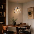 Modern Silver Pumpkin Art Glass Pendant Light Over Round Dining Table
