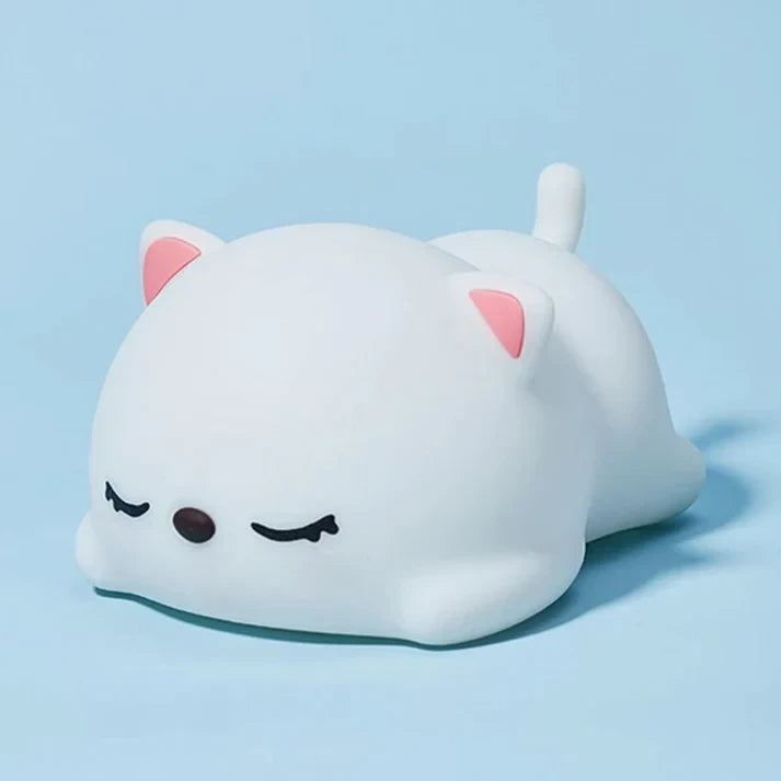 Cute Silicone Sleeping Cat Night Light on Blue Background Studio Display