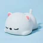 Cute Silicone Sleeping Cat Night Light on Blue Background Studio Display