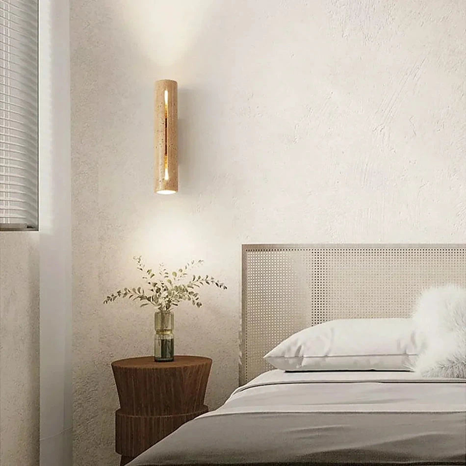 Minimalist Travertine Cylinder Wall Light Over Bedside Area