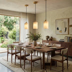 Modern Cylindrical Alabaster Pendant Lights Over Dining Room Table