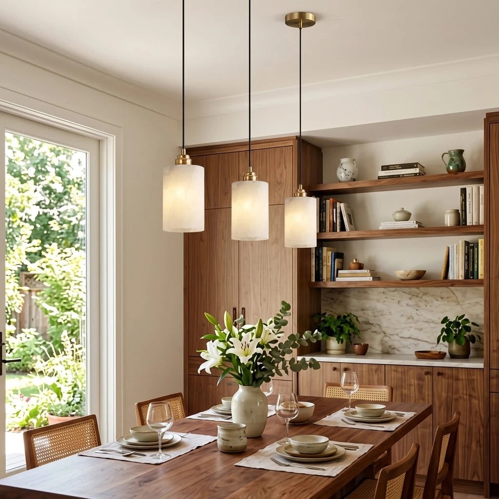 Modern Cylindrical Alabaster Pendant Lights Over Dining Area