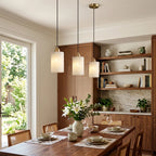 Modern Cylindrical Alabaster Pendant Lights Over Dining Area