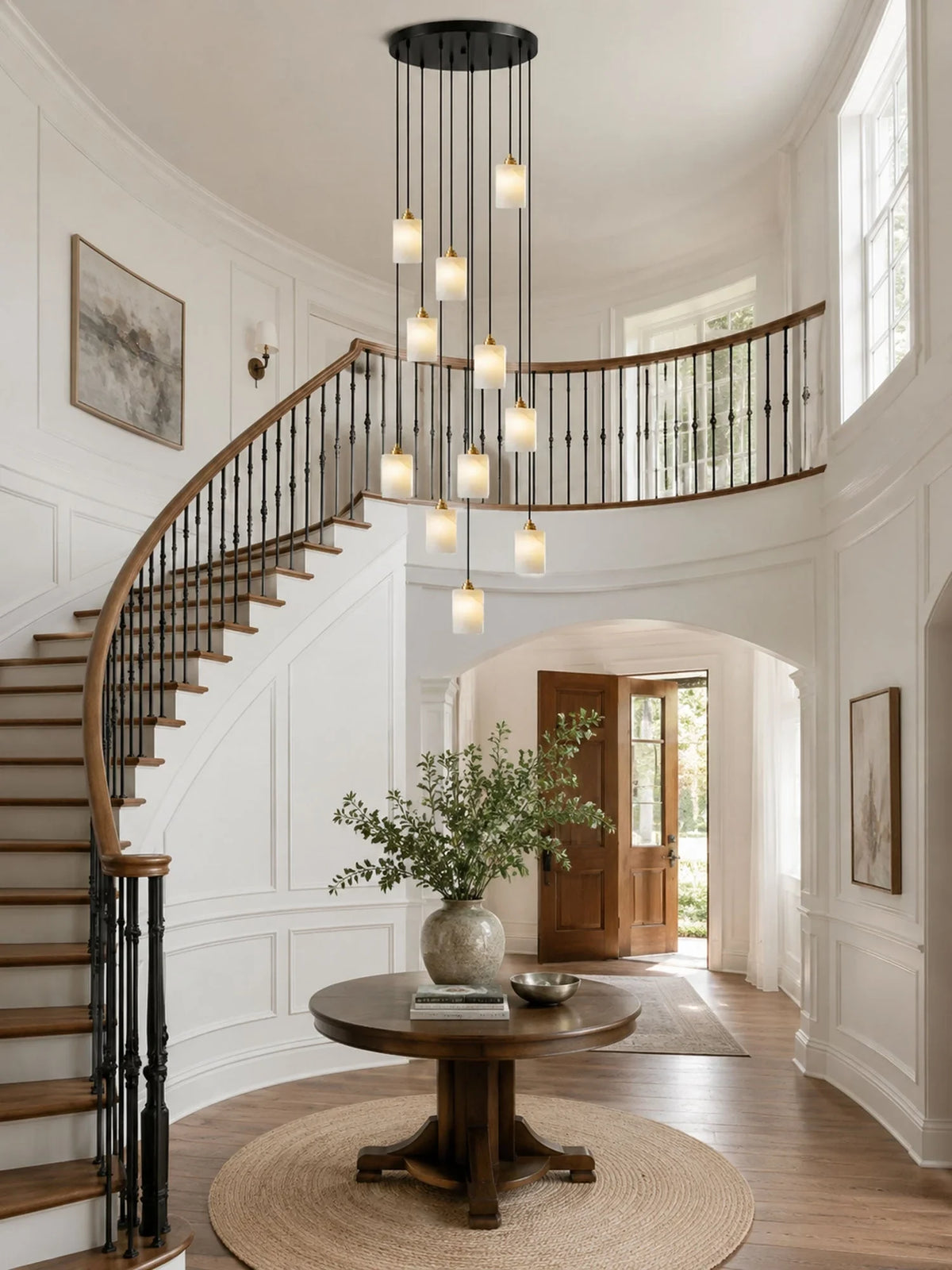 Modern Cascading Cylindrical Alabaster Pendant Lights in Staircase Foyer
