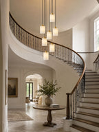 Modern Cascading Cylindrical Alabaster Chandelier in Grand Stairwell