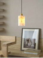 Modern Cylindrical Alabaster Pendant Light Over Master Bedroom Bedside