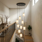 Modern Cascading Cylindrical Alabaster Pendant Lights in Vaulted Stairwell Foyer