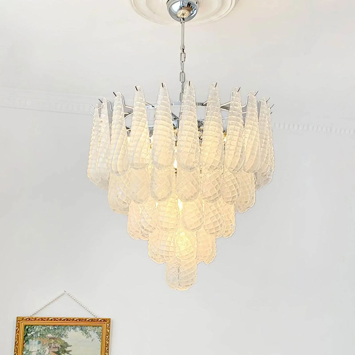 Upward View of Illuminated Modern Frosted White Feather Chandelier Studio Display