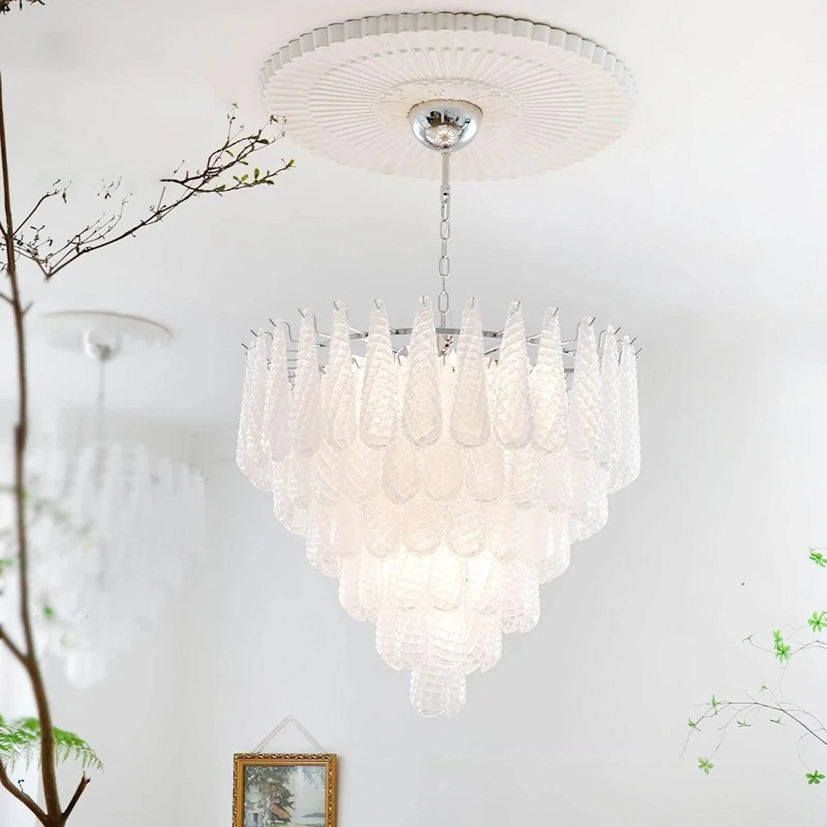 Upward View of Illuminated Modern Silver Frame Frosted White Feather Chandelier Studio Display