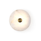 Modern Minimalist Natural Marble Round Disc Wall Sconce with Center Brass Knob on Pure White Background
