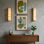 Pair of Double Cylinder Alabaster Sconces Flanking Art Prints