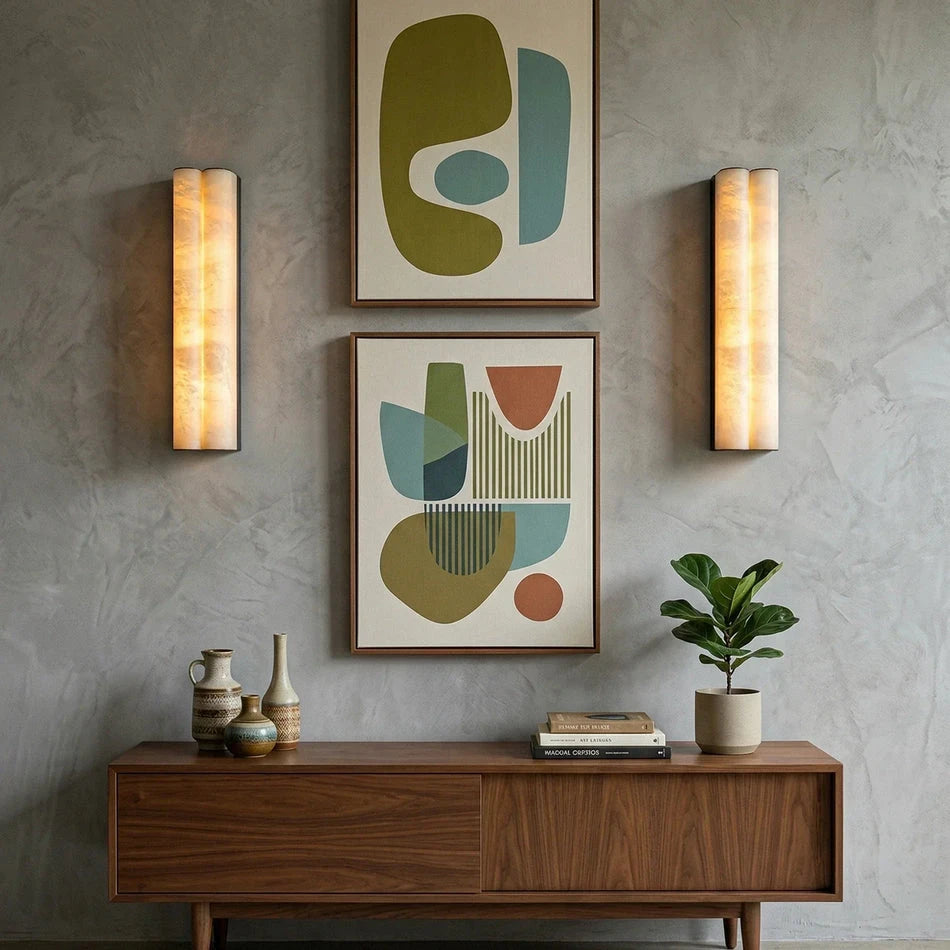 Pair of Double Cylinder Alabaster Sconces Flanking Art Prints