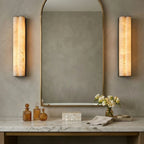 Pair of Double Cylinder Alabaster Vanity Sconces Flanking Bathroom Mirror