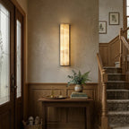 Modern Alabaster Wall Sconce Illuminating Staircase Hallway
