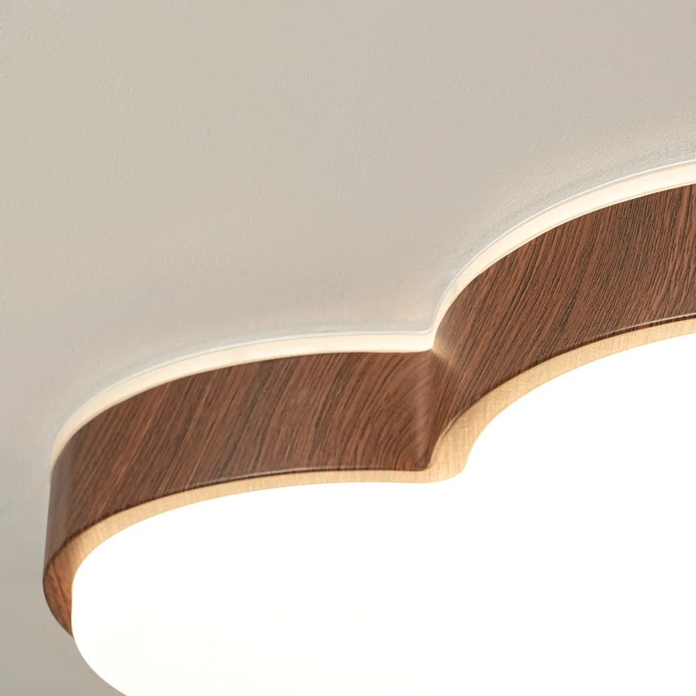 Close Up View of Wood Frame and Backlit Glow on Cloud Ceiling Light