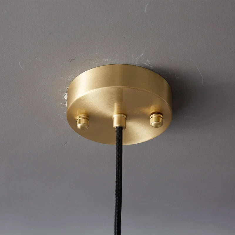 Close Up View of Brass Canopy and Suspension Cord