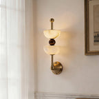 Side View of Illuminated Modern Alabaster Wall Sconce Studio Shot