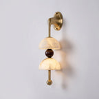 Angled View of Illuminated Modern Dual Alabaster Bowl Wall Sconce