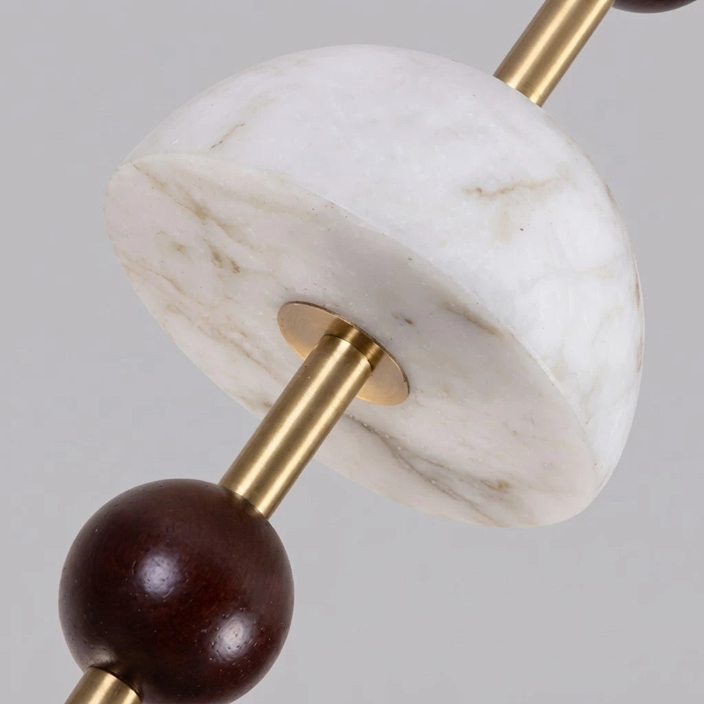 Close Up View of Alabaster Bowls, Wood Sphere, and Brass Stem