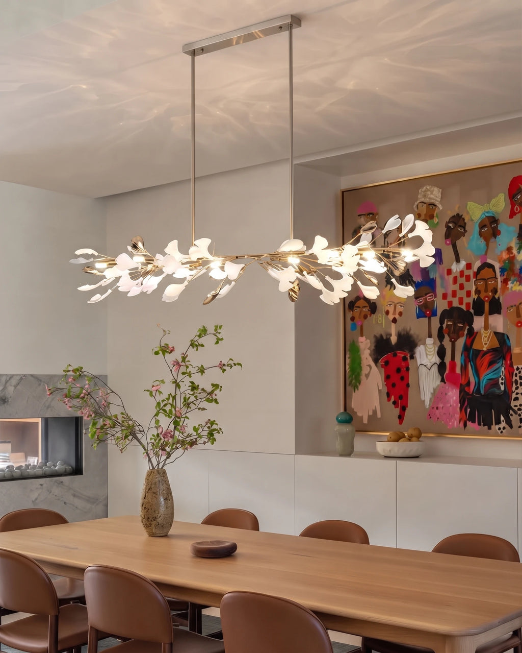 Modern Extended Gold Ginkgo Leaf Chandelier Over Long Dining Table