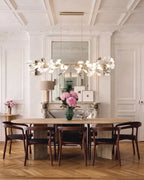 Modern Gold Ginkgo Leaf Linear Chandelier in Elegant Dining Room