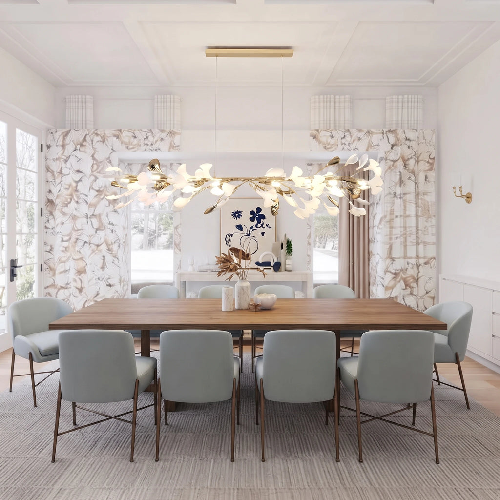 Modern Gold Ginkgo Leaf Linear Chandelier Over Large Dining Table