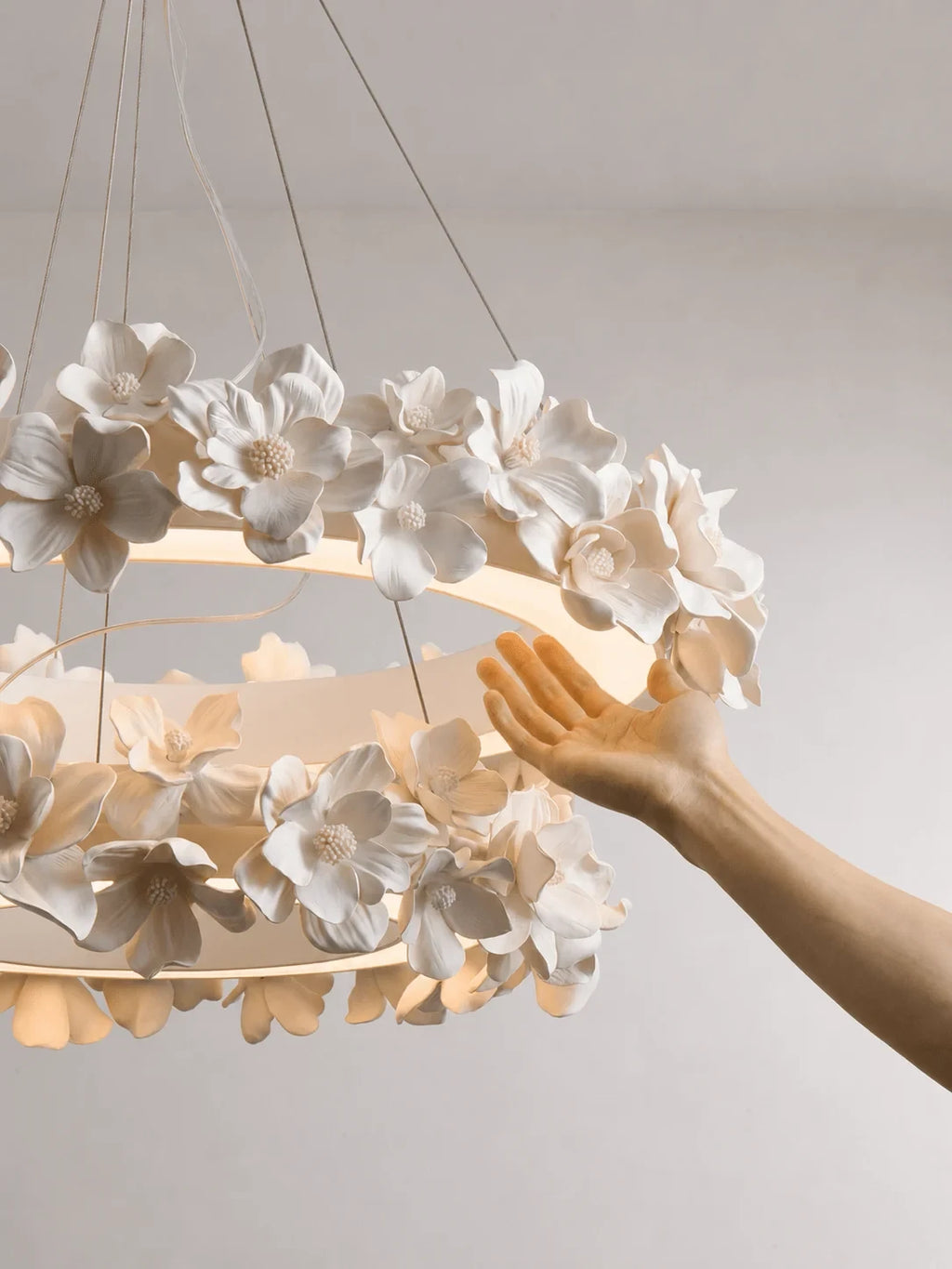 Hand Adjusting Petals on Modern Floral Ring Chandelier