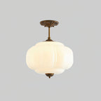 Cream white pumpkin glass vintage ceiling lamp antique bronze hardware isolated backdrop