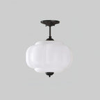 Pure white vintage pumpkin glass ceiling lamp black fitting isolated background