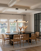 Modern Linear Alabaster Pendant Light Over Wooden Dining Table