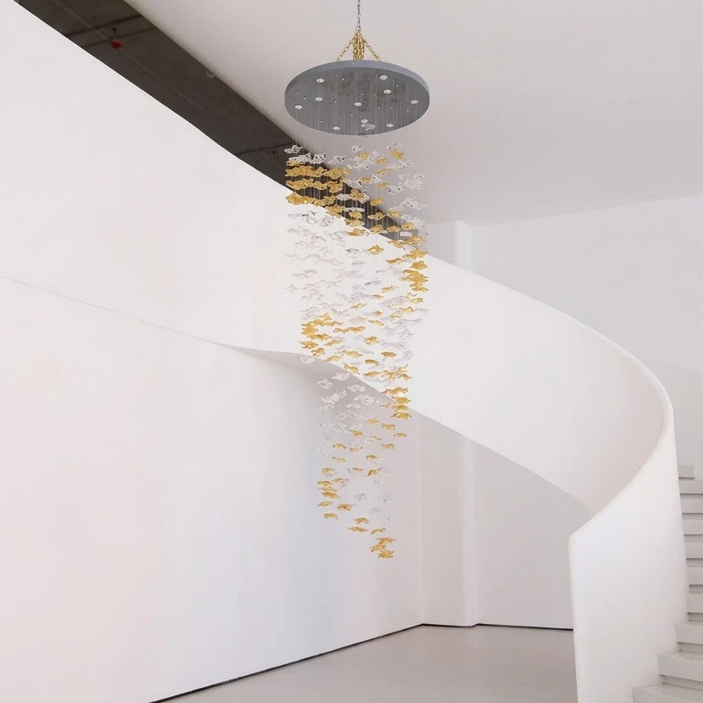 Large custom chandelier installation for a curved staircase atrium