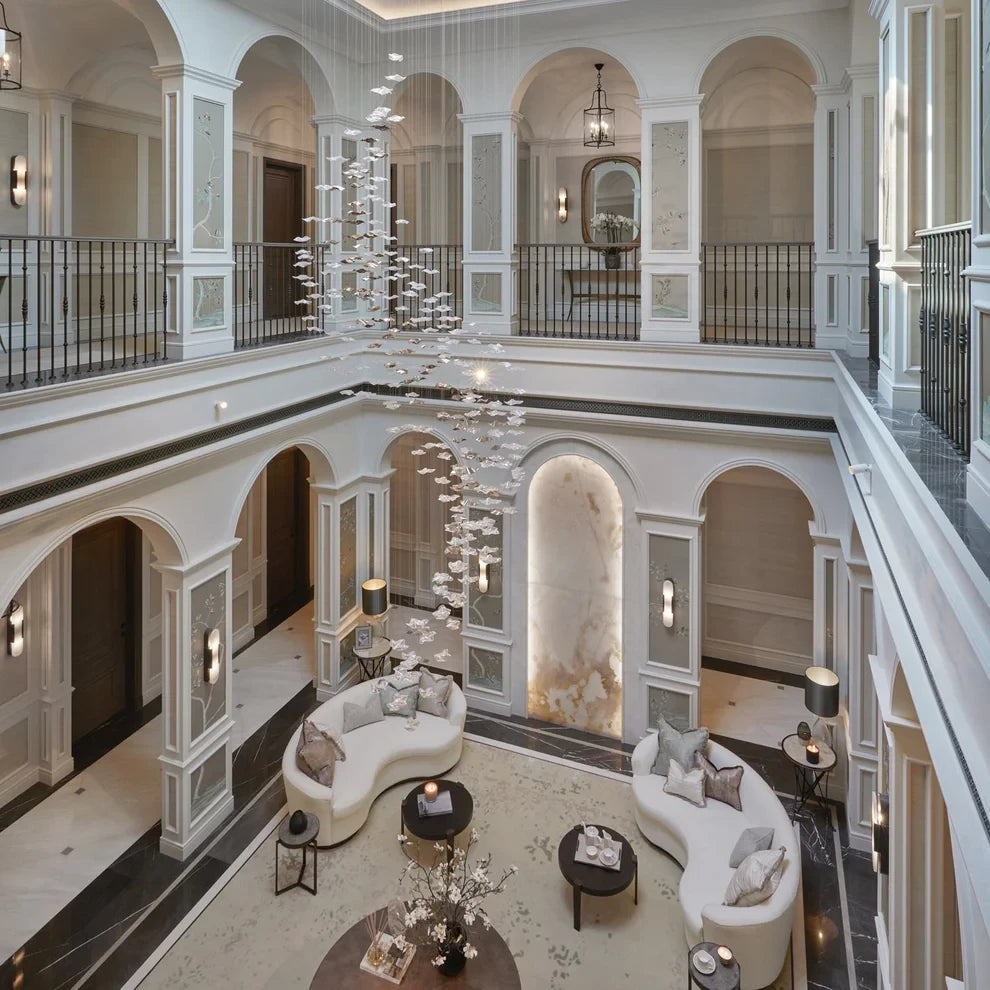 Large custom cascading chandelier in a luxury multi-storey interior