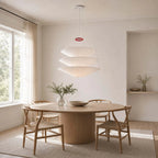 Modern White Fabric Tiered Chandelier Over Round Dining Table