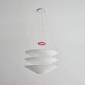 Angled View of Illuminated Modern Cascading White Fabric Chandelier