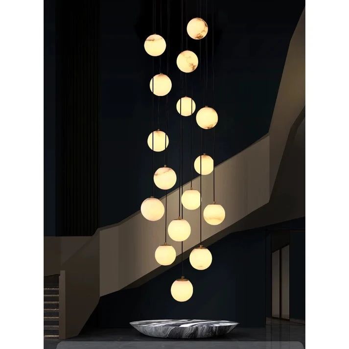 Long Cascade Globe Alabaster Chandelier Over Modern Stairwell