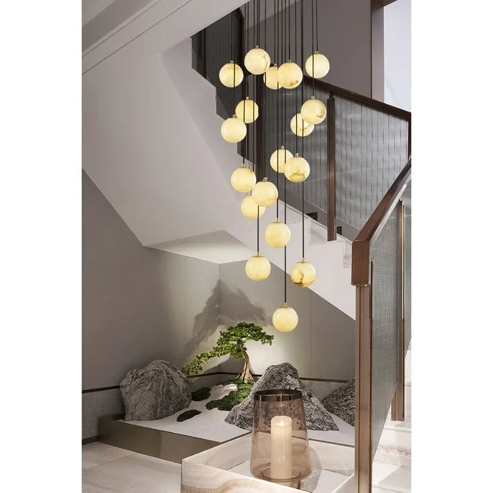 Multi Sphere Alabaster Chandelier Over Staircase Landing