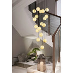 Multi Sphere Alabaster Chandelier Over Staircase Landing