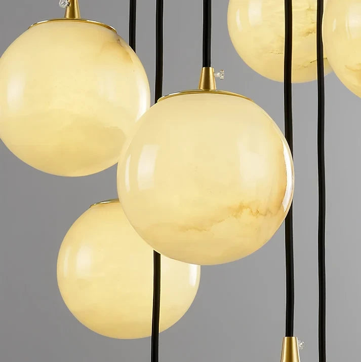 Close Up View of Translucent Alabaster Spheres and Brass Sockets