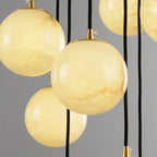 Close Up View of Translucent Alabaster Spheres and Brass Sockets