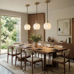 Modern Alabaster Pendant Lights Over Dining Area