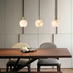 Modern Round Alabaster Pendant Lights Over Dining Table